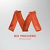 Die Macherei Logo auf Metallhintergrund
